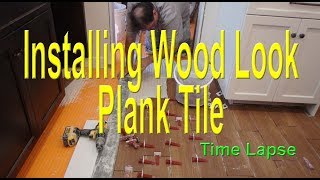 Wood look plank tile installation on Schluter Ditra start to finish time lapse [upl. by Wash593]