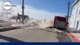 Massive wave in California sweeps people away and floods streets [upl. by Akinohs]