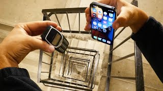 Dropping an iPhone 13 Pro vs Nokia 3310 Down Spiral Staircase 20 Stories  Will it Survive [upl. by Nester]