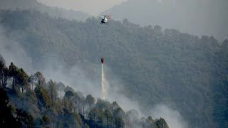 Fire at Shivapuri National Park  Budhanilkantha  Helicopter are being used to control the fire [upl. by Opiuuk710]