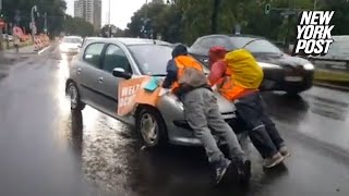 Irate drivers ram into climate protesters blocking traffic drag them hundreds of feet down highway [upl. by Kajdan16]