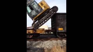 Unloading excavator from rail car [upl. by Yecrad]