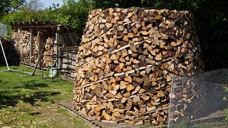 Building a round wood pile Holz Hausen [upl. by Yorick]