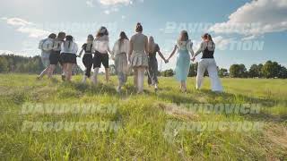 Friends walking through a field on a summer day holding hands [upl. by Aneer]