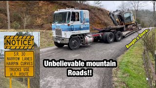 Hauling my new super cheap excavator off of a huge mountain with a untested cabover SKETCHY [upl. by Inalaeham]