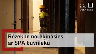 Rēzeknes pašvaldība vienojas ar SPA centra būvnieku par parādu atmaksu [upl. by Weisberg612]