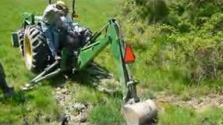 Banu runs the John Deere Backhoe on the farm [upl. by Vandervelde]