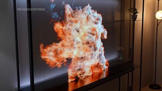 At CES LG unveils ‘world’s first’ wireless transparent OLED TV [upl. by Adnaluy921]