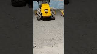 vibrating soil compactor with powered rotating drum and functioning grade blade [upl. by Shakti]