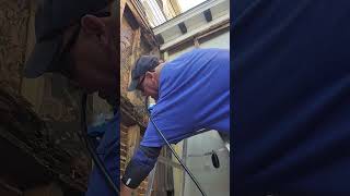 Explaining the process of filling holes between studs and brick foundation [upl. by Ogdon102]