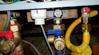 Man Tips Troubleshooting Rheem Tankless Hot Water Heater [upl. by Halullat]