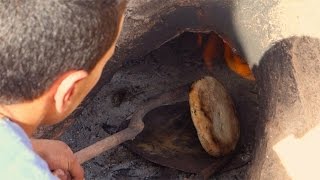 Moroccan bread made in a clay oven  Khobz  Authentic recipe from Sahara [upl. by Becca56]