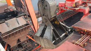 Unloading a 300 meter coal bulk ship Bucket crane with massive bucket close to the wheelhouse [upl. by Kwei]