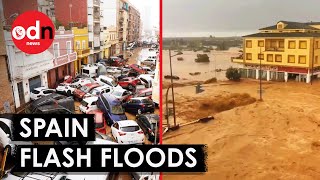 Terrifying Footage Shows Flash Floods in Spain Sweep Away Walls and Cars [upl. by Esbensen3]