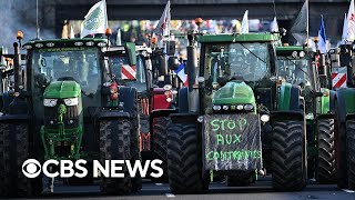 Farmers protest in France blocking roads to Paris with manure and farm equipment [upl. by Sivolc]