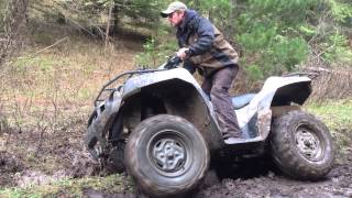 2006 Brute Force 750 4x4i diff lock in mud [upl. by Eleanore]