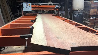 Flattening and sanding a redwood slab with the woodmizer slab flattening machine planing sped up [upl. by Onileba]