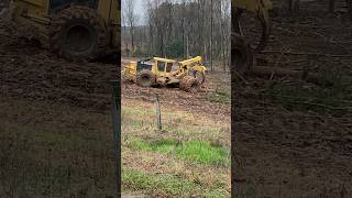 Duel tire log skidder hung in the mud logging tigercat skidder [upl. by Ardnuasal646]