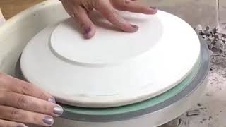 Using the pottery wheel to throw dinner plates on plaster forms [upl. by Enyawad]