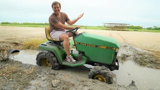 Taking the John Deere mower mudding [upl. by Eillod]