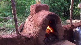 Installing a fireplace in a debris shelter [upl. by Kcirddehs]