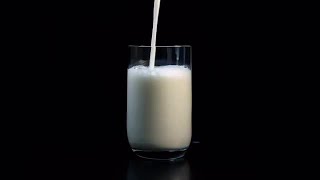 Pouring Milk Into A Glass Stock Video [upl. by Ferneau]