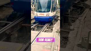 Tram going over exposed rails on open excavation [upl. by Monti]