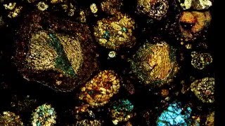 Microscopic views of thin sections of meteorite [upl. by Euqirdor]