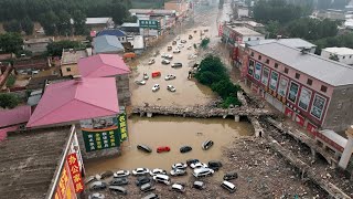 China in chaos Extreme rainfall causes worst flooding entire cities trapped [upl. by Ycinuq843]