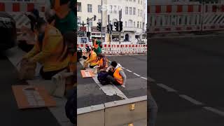 Ecoprotester tries to get in front of car and initially gets knocked over [upl. by Oetomit261]