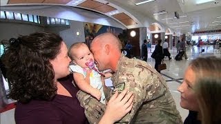 A military homecoming sealed with a kiss [upl. by Mcclimans]