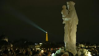 Paris NotreDames replica statue returns in a torchlight procession  AFP [upl. by Nilkcaj997]