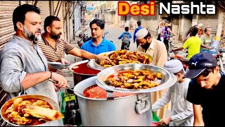 100 RsEXPLORING PAKISTANI PUNJABI DESI NASHTA  BEST STREET FOOD IN LAHORE  BONG PAYE  CHANAY [upl. by Ietta]