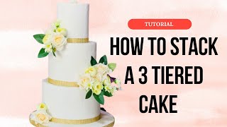 How to stack a 3 tiered cake [upl. by Elrebmik693]