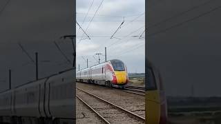 Train at BARNBY LEVEL CROSSING CLAYPOLE 11124 HarrogateKings cross AZUMA [upl. by Fleurette]