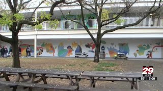 Charlottesville High School students work on huge mural [upl. by Aiekam]