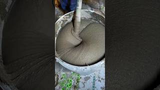 Construction worker mixing plaster coating with mixer [upl. by Terra497]