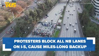 Protesters calling for ceasefire in Gaza block all NB I5 lanes in Seattle [upl. by Derick]