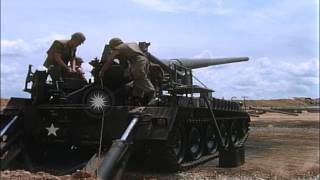 A soldier gives a signal to fire and other soldiers load an M107 Self Propelled 1HD Stock Footage [upl. by Veda]