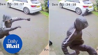 Shocking CCTV shows burglars trying to kick down front door [upl. by Onia]