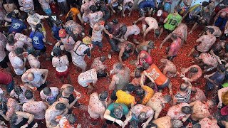 Thousands enjoy annual Tomatina tomato fight festival in Bunol Spain [upl. by Barbra]