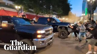 Trump supporters drive through crowd and pepper spray protesters in Portland [upl. by Orianna844]