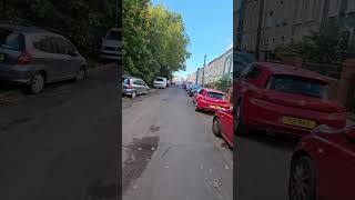 UK Englands A Cyclist Wearing Jeans amp Tshirt Riding a Pink Bicycle Cars Vans [upl. by Terzas]