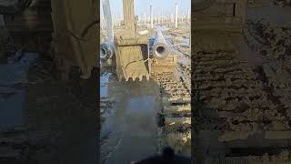 The process of dragging power piles through mud Good tools and machinery make work easy [upl. by Alleira428]