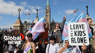 Dueling protests over the issue of transgender policy in schools held in cities across Canada [upl. by Cirdahc]