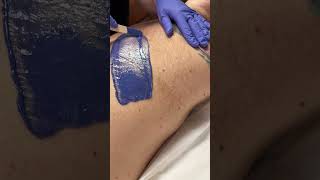 Professional waxing male back using hard wax starflex from Starpil esthetician waxing [upl. by Aisorbma]