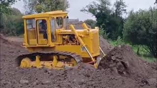 Caterpillar D6C dozer working [upl. by Annahsat95]