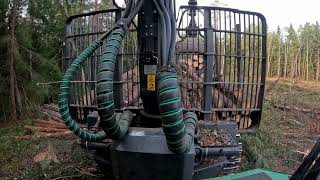 John Deere 1010G Loading spruce pulpwood [upl. by Airogerg]