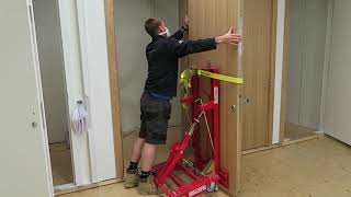 Heavy door install using door lift equipment  TMJ Interiors [upl. by Berardo]