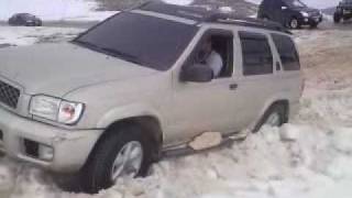 Nissan Pathfinder stuck in deep snow [upl. by Oinoitna]